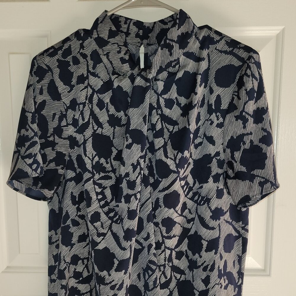Navy and White patterned blouse with knot detail